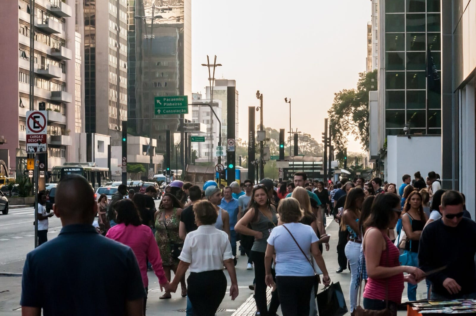 Crowds on the pavement of Avenida Paulista in São Paulo in the late afternoon