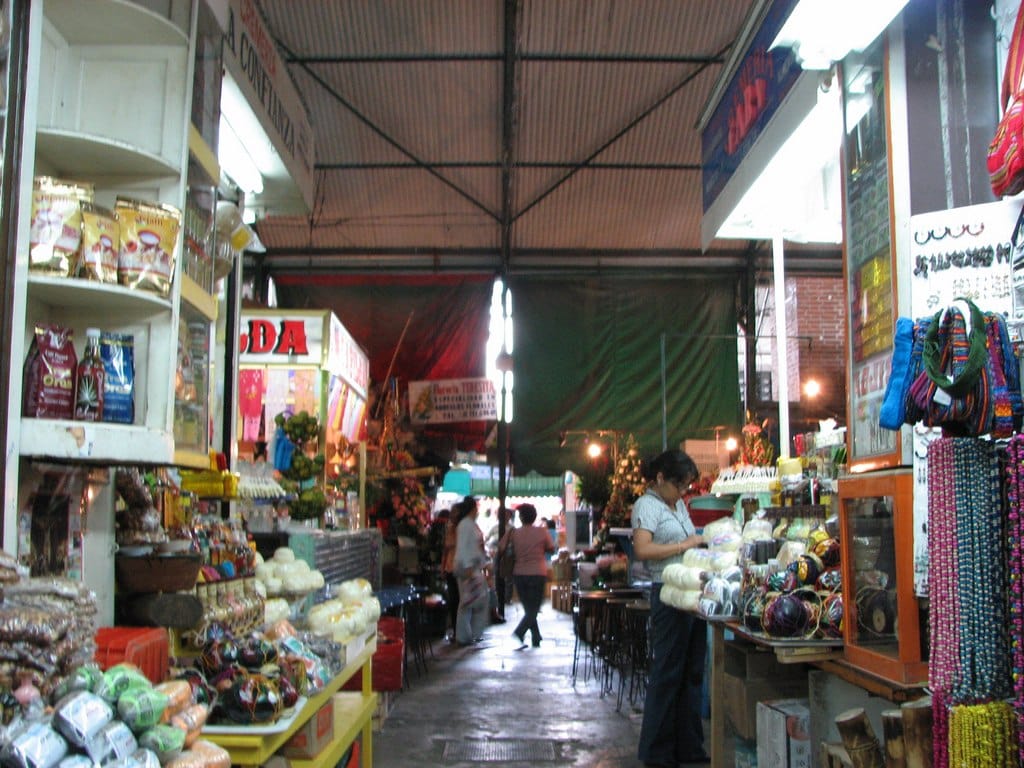 Stalls and shoppers inside the Benito Juárez market in Oaxaca