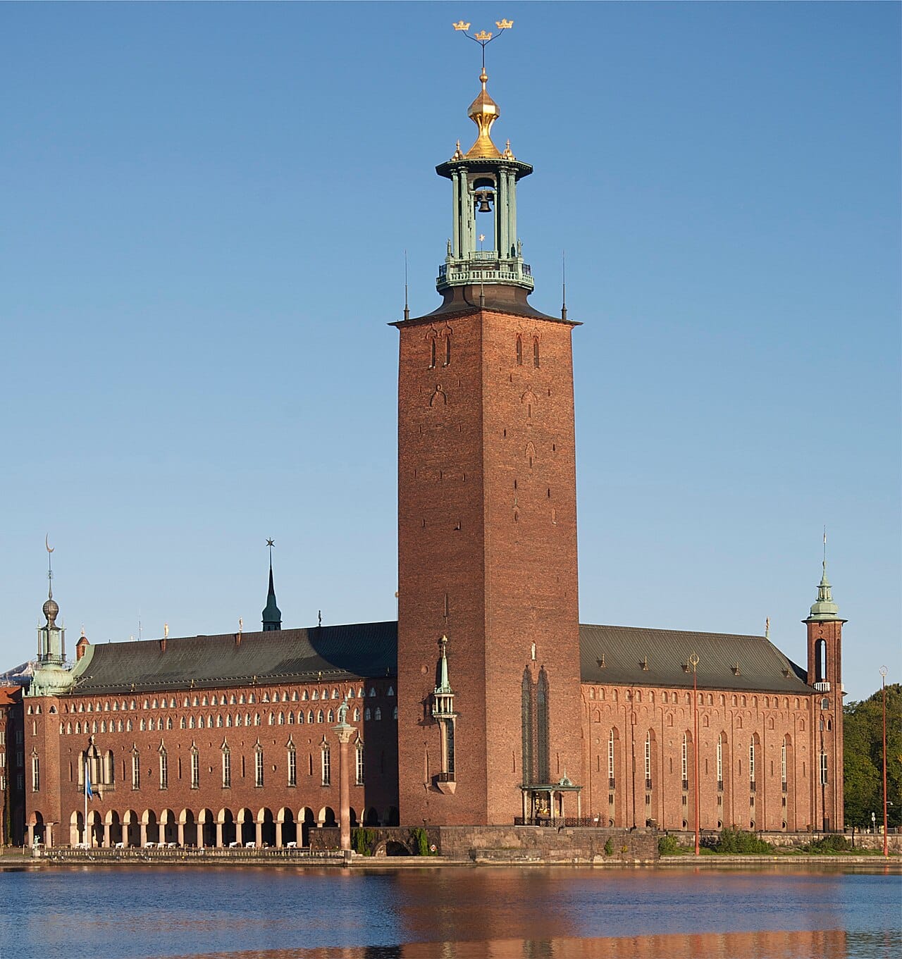 Stockholm City Hall and its Three Crowns tower beside the water