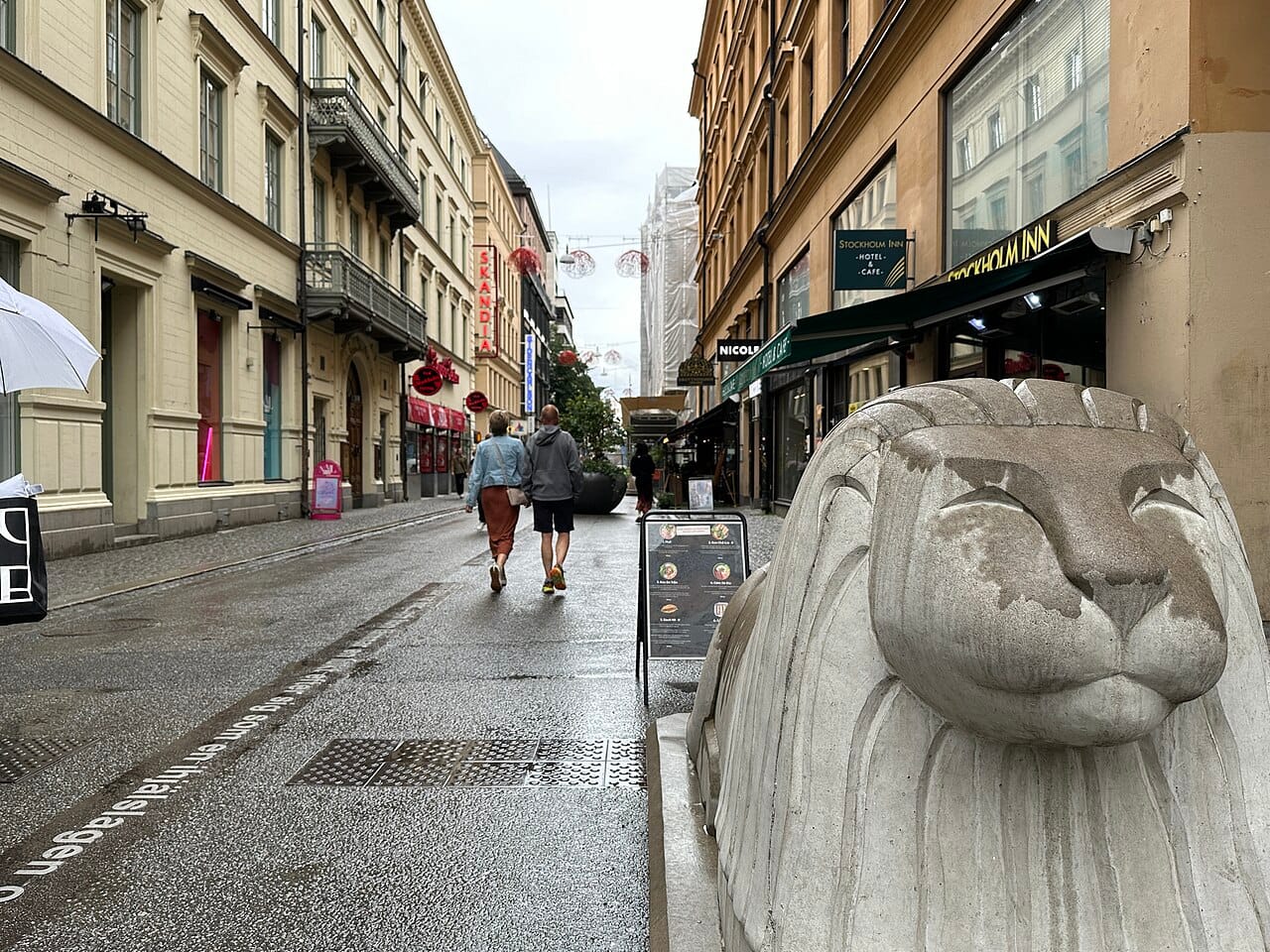 People walking along Drottninggatan in central Stockholm