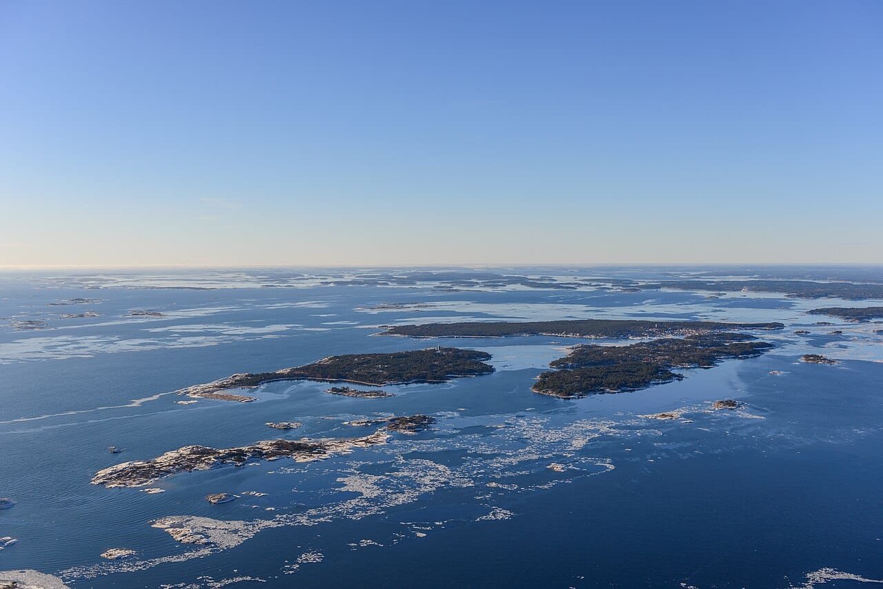 Low islands scattered across open water, seen from the air