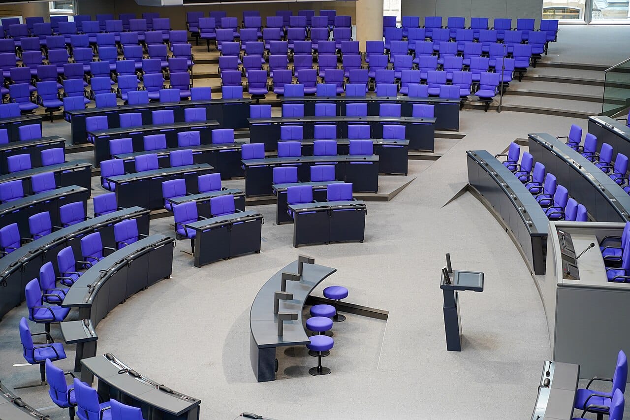 A parliamentary plenary chamber, the speaker’s rostrum in front of the government bench