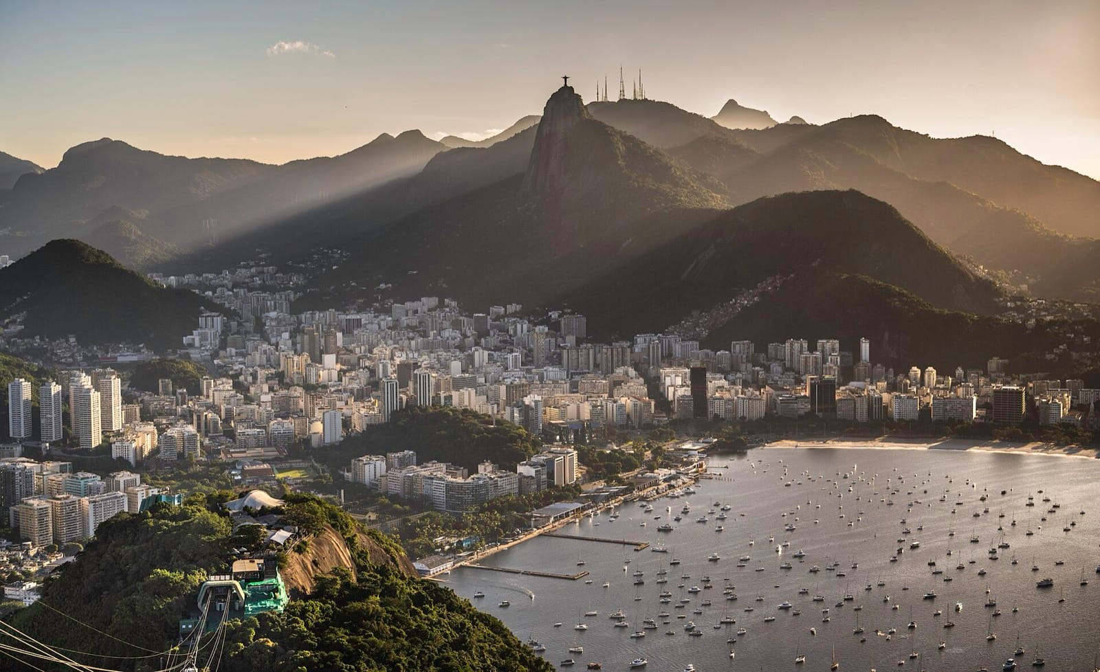 Rio de Janeiro at sunset seen from Sugarloaf, with Corcovado behind the city and Botafogo bay in front of it