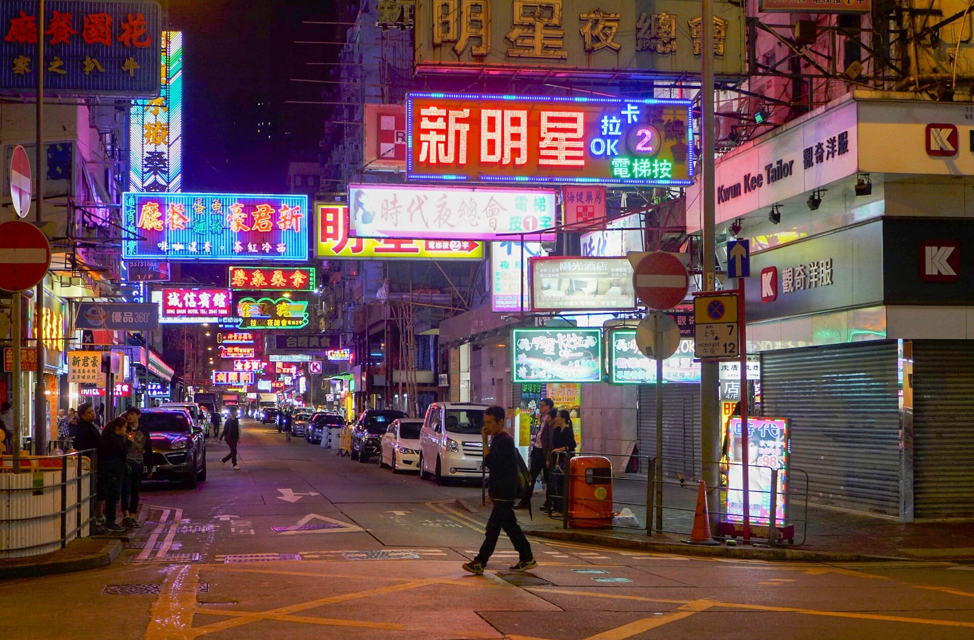 Neon shop signs crowding over Portland Street in Mong Kok, Hong Kong