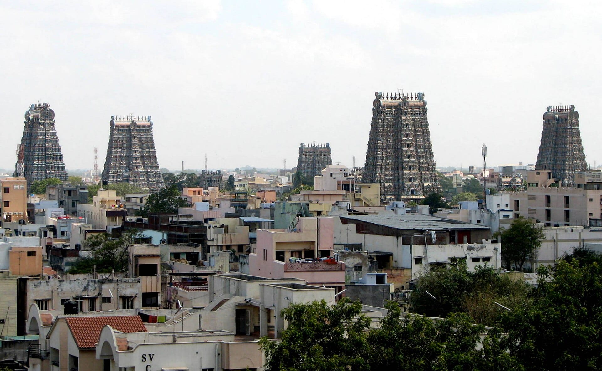 The gopurams of the Meenakshi temple over the rooftops of Madurai