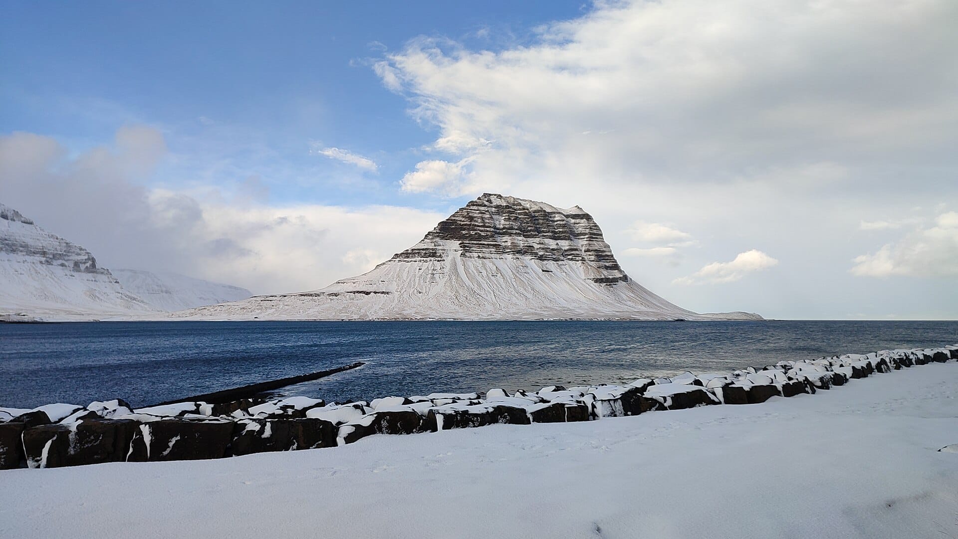 Kirkjufell rising above the fjord on the Snæfellsnes peninsula in winter