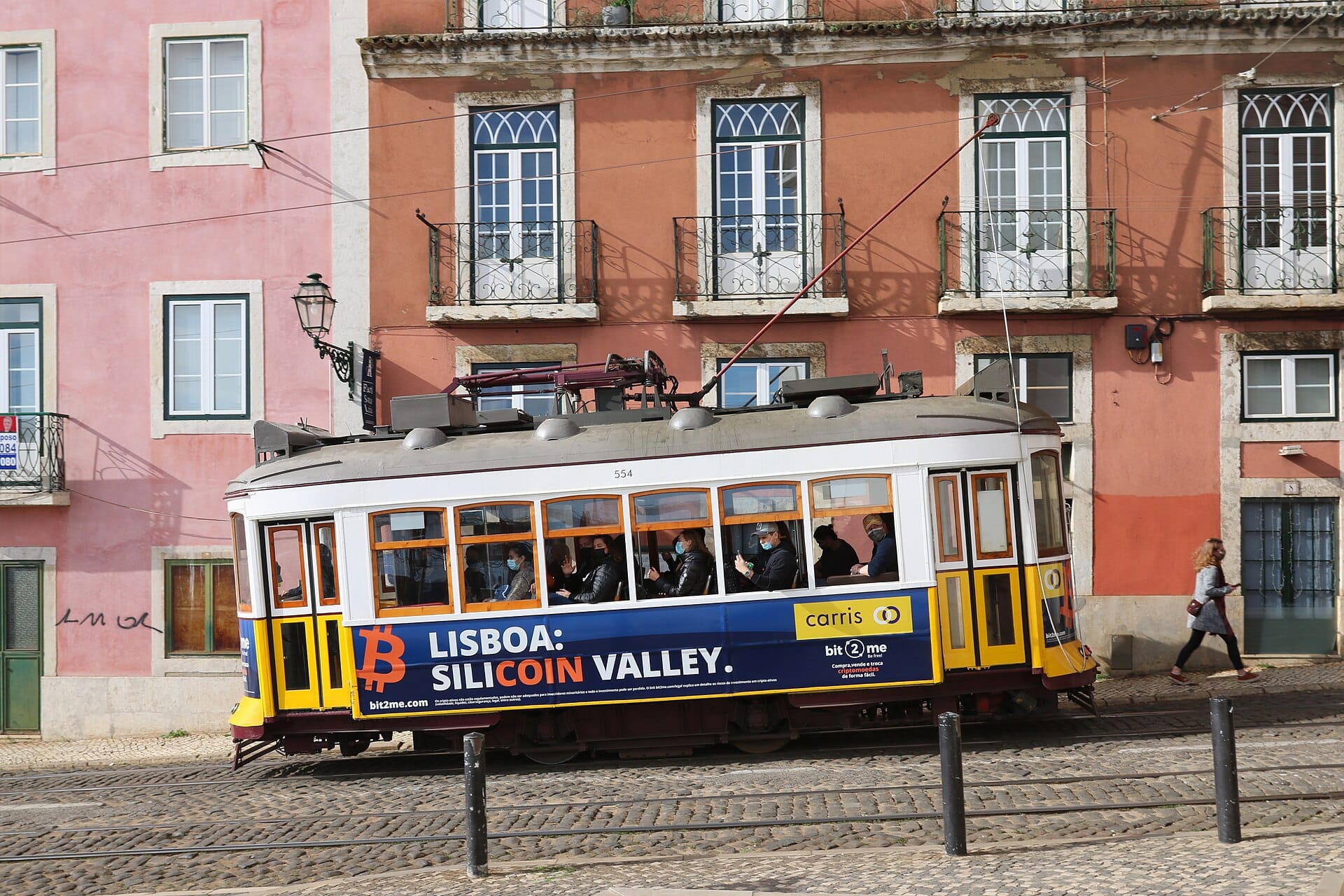 A tram on the narrow street at Largo Santa Luzia in the Alfama, Lisbon