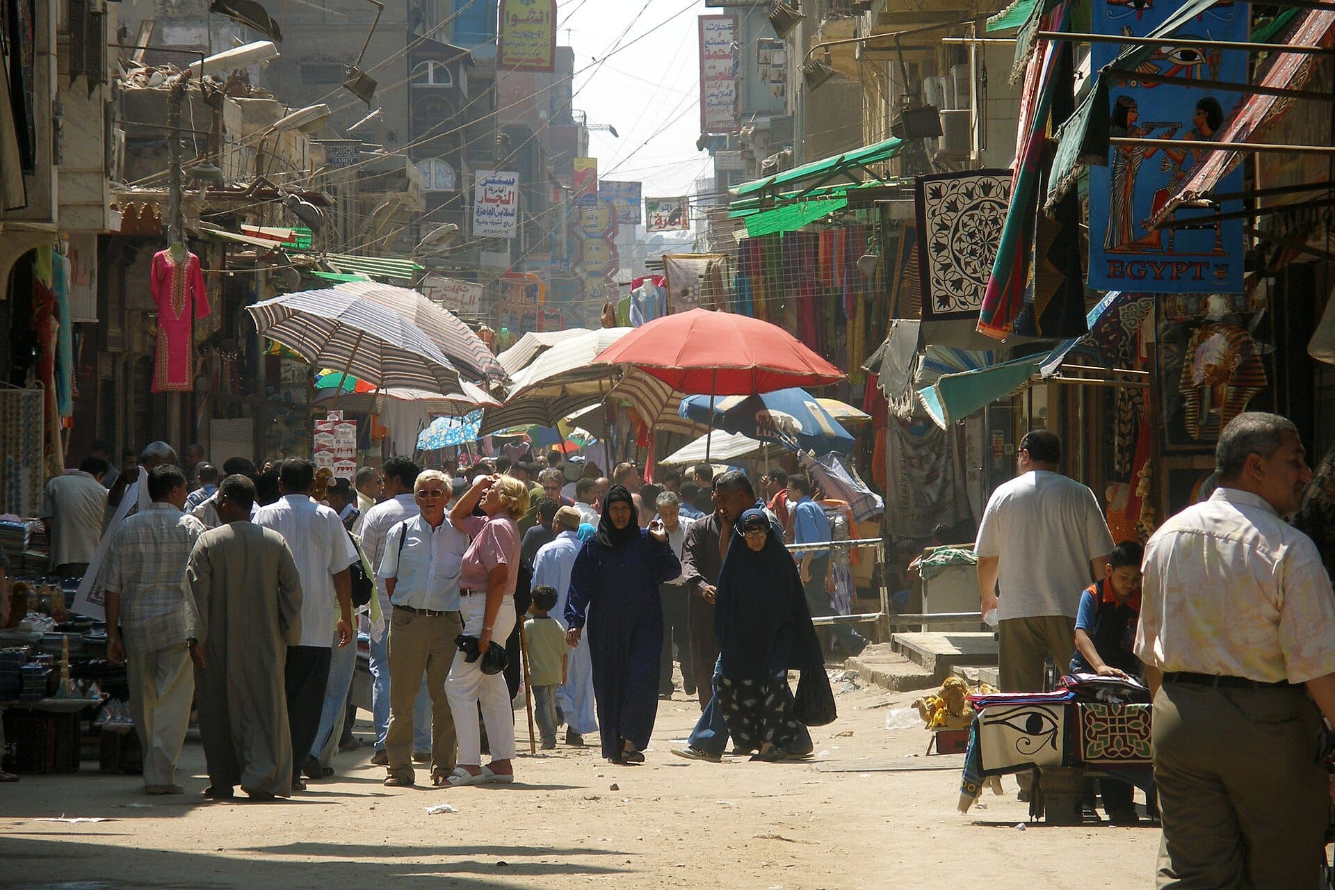 The crowded market street off al-Muizz in Islamic Cairo, under its parasols