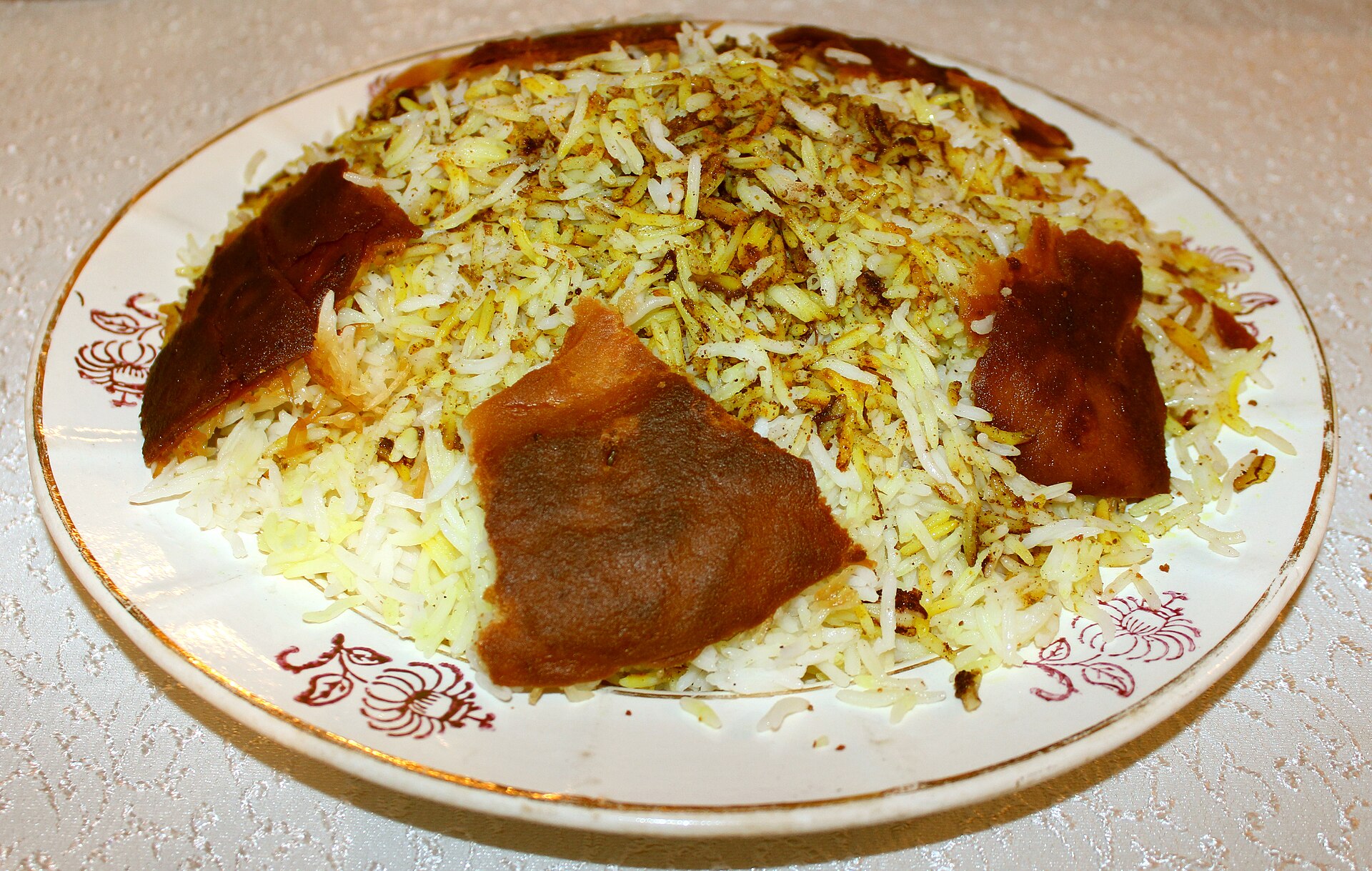 Azerbaijani plov with rice and a crisp golden crust