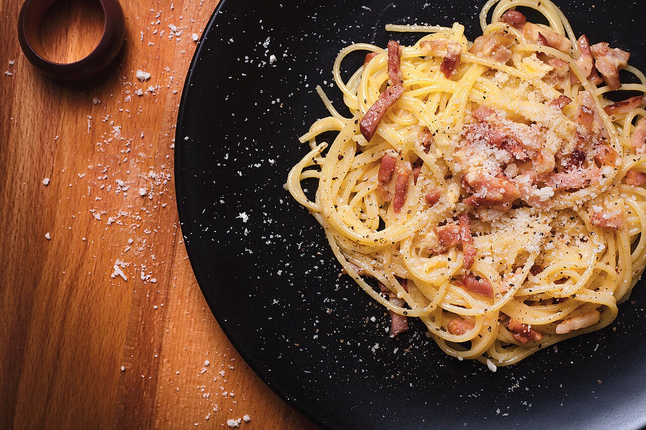 Spaghetti carbonara, a Roman dish shared with the surrounding Italian food culture
