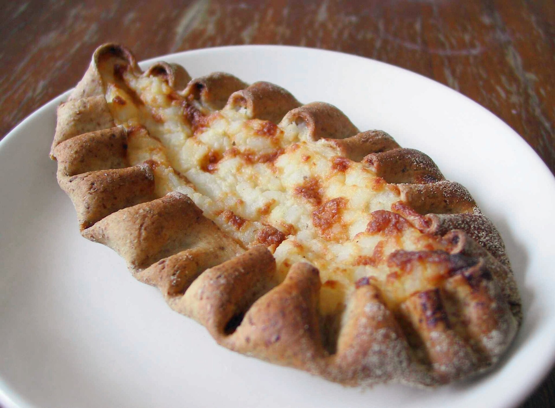 A Finnish Karelian pie with a rye crust and rice-porridge filling