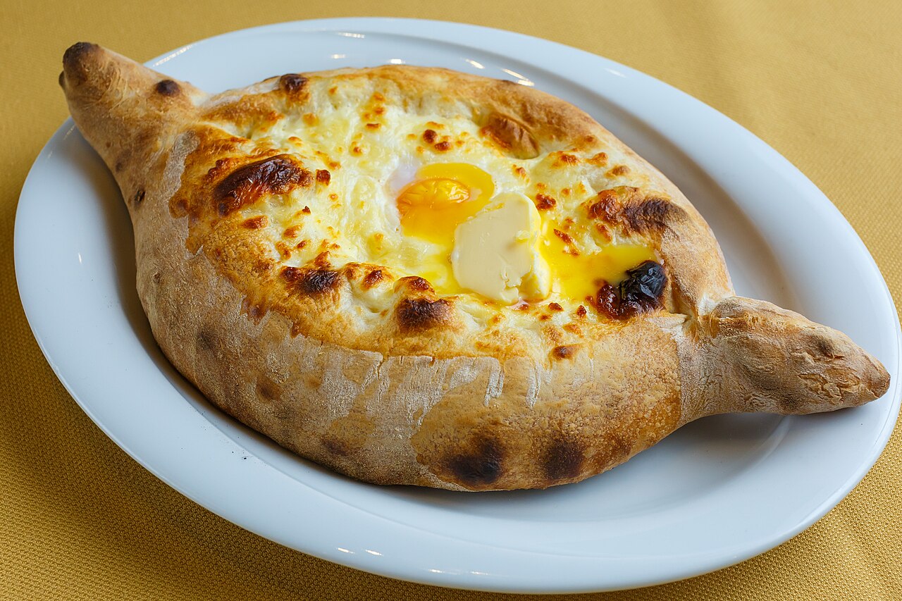Adjarian khachapuri with cheese, egg and butter