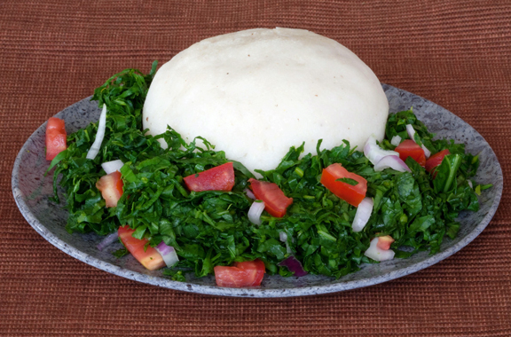 Ugali and sukuma wiki served in Kenya