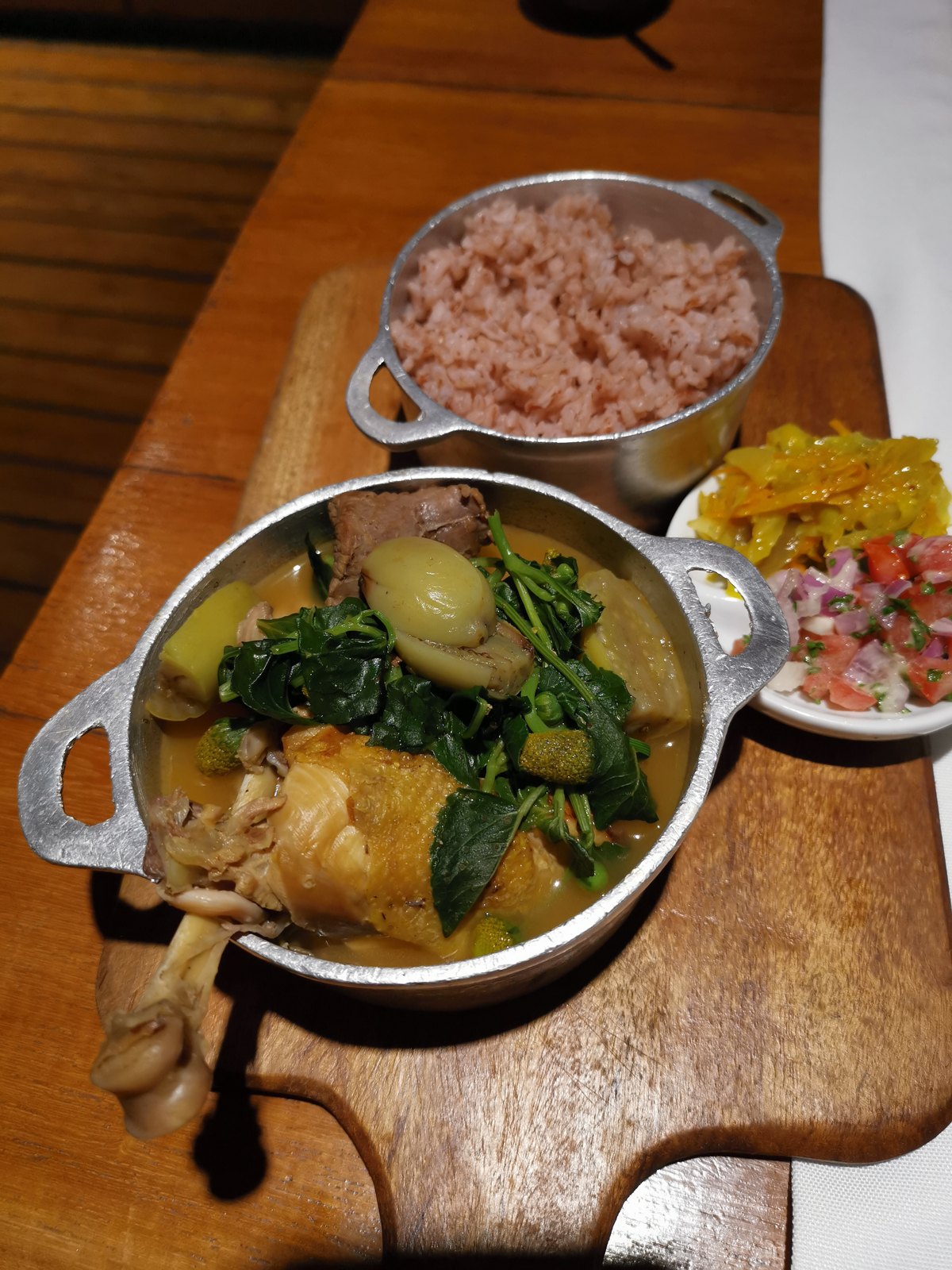 A Malagasy stew served with rice and accompaniments