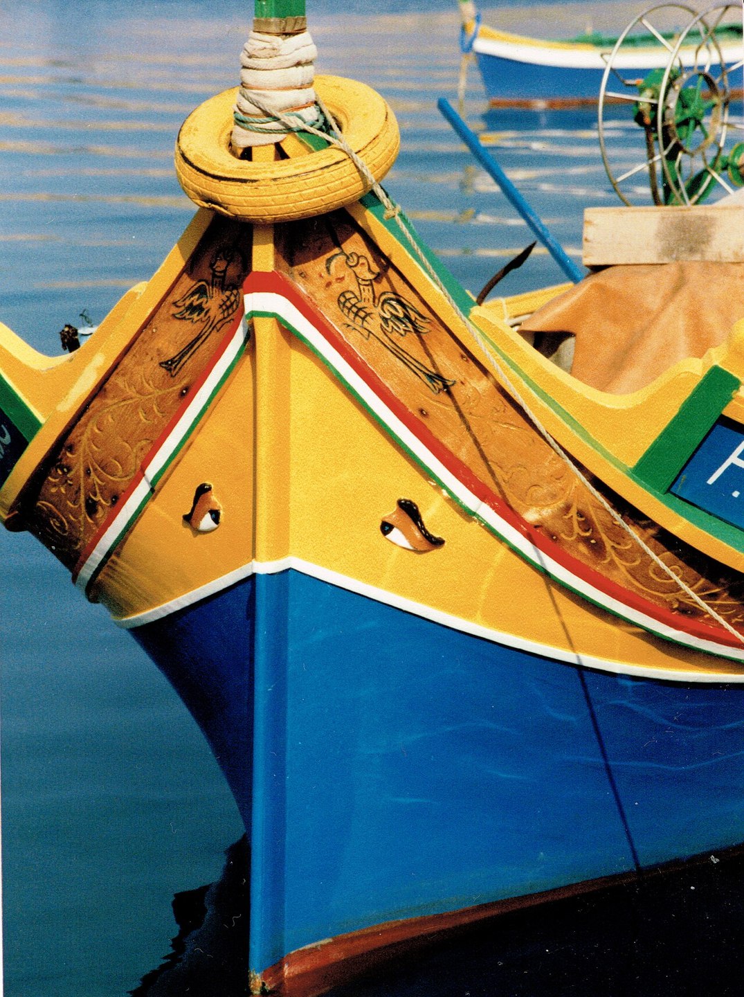 A traditional painted fishing boat in Marsaxlokk Harbour, photographed in 1985