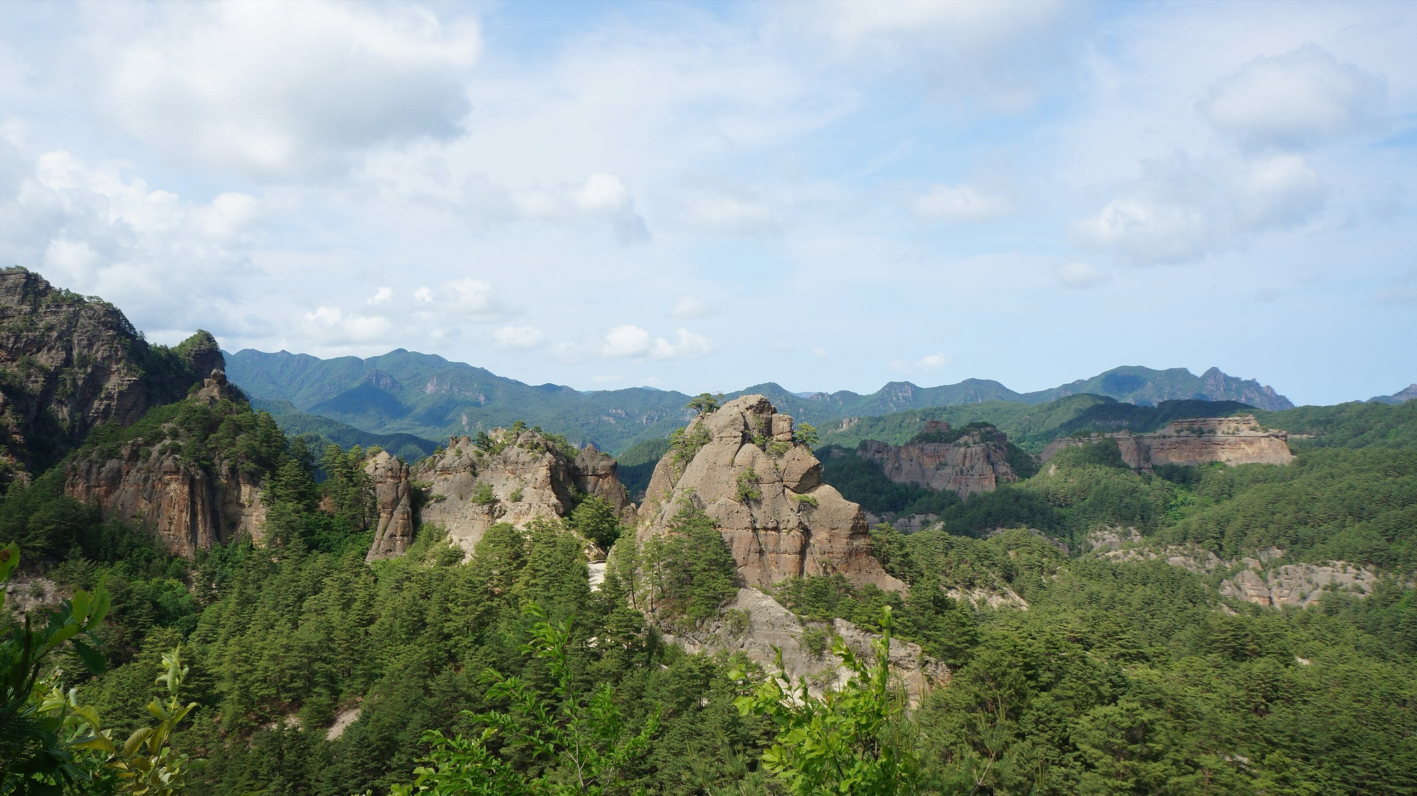 Granite pinnacles rising from pine forest in the Chilbo Mountains of North Korea