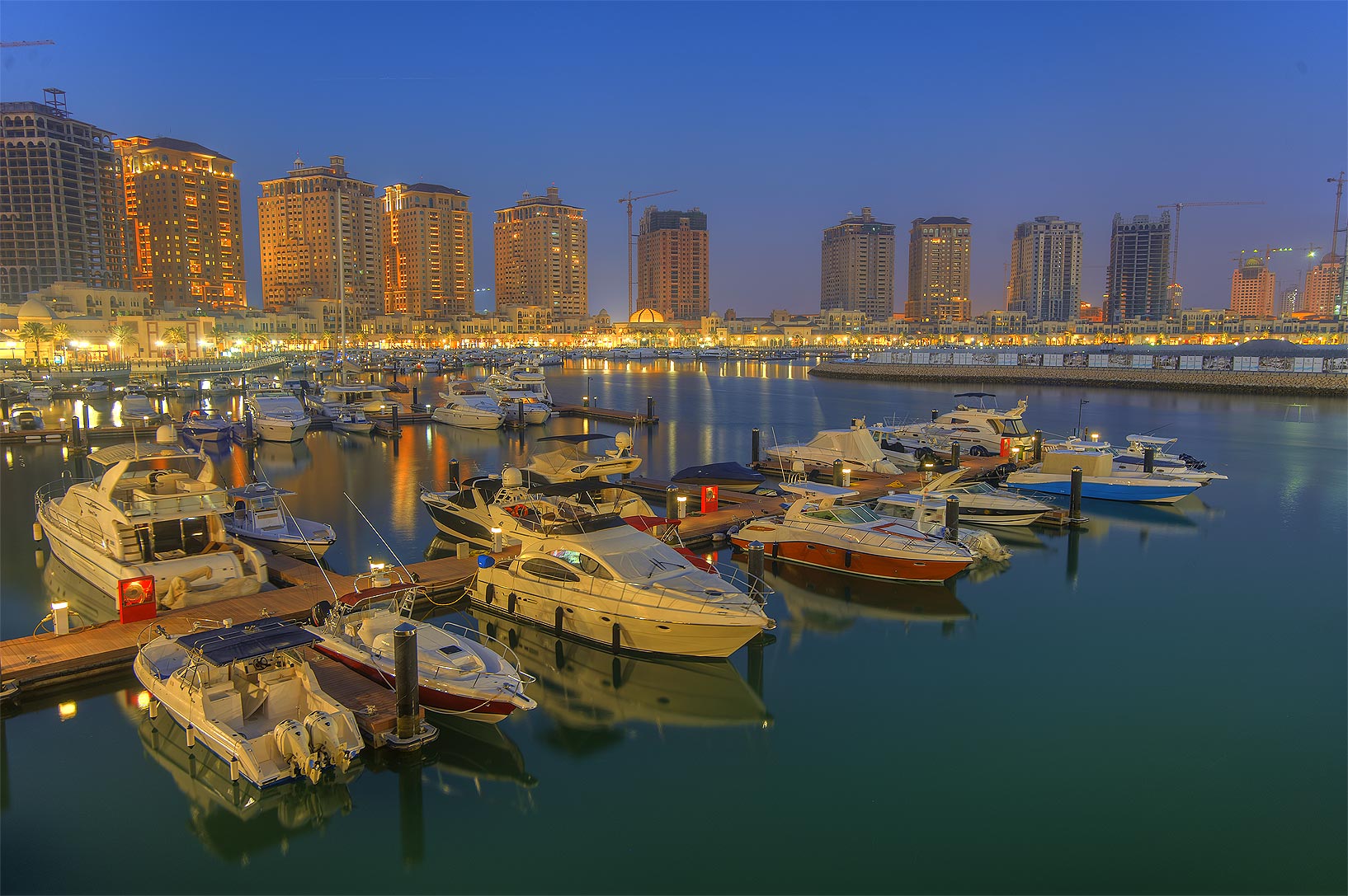 Boats and waterfront buildings at Porto Arabia on The Pearl in Qatar, photographed in 2013