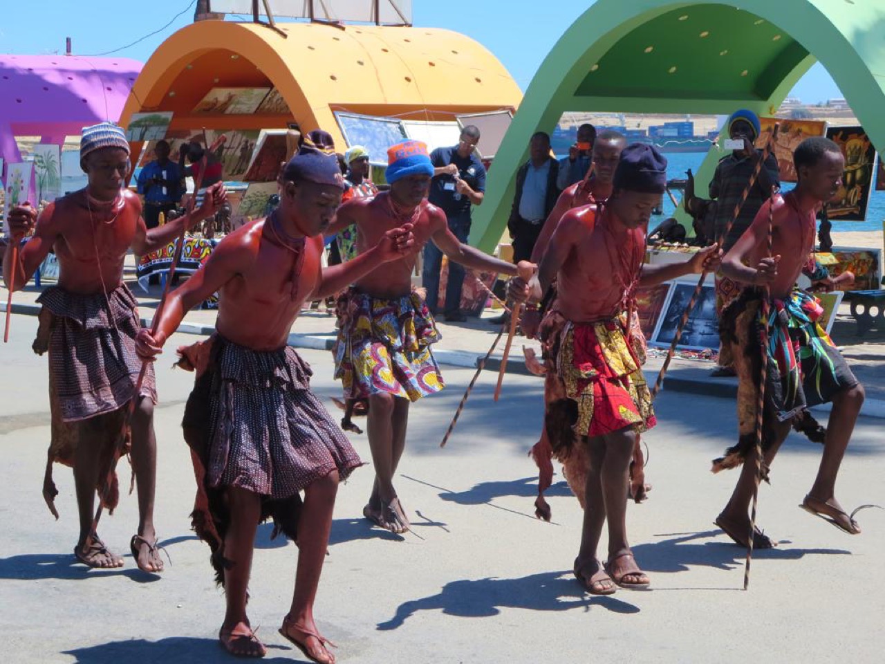 Traditional dancers on a beach in Namibe, Angola