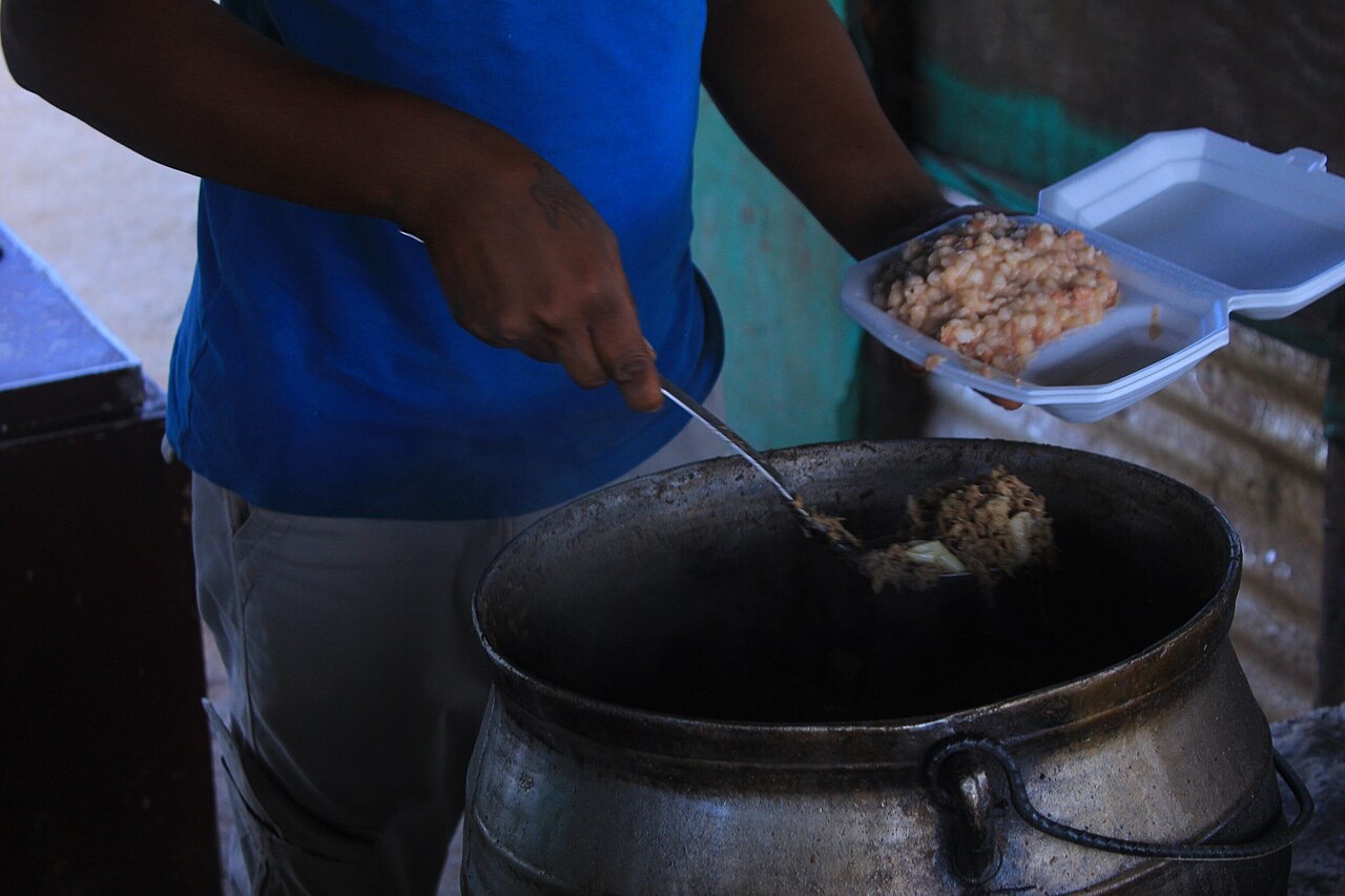 A vendor serving seswaa and dikgobe, Botswana