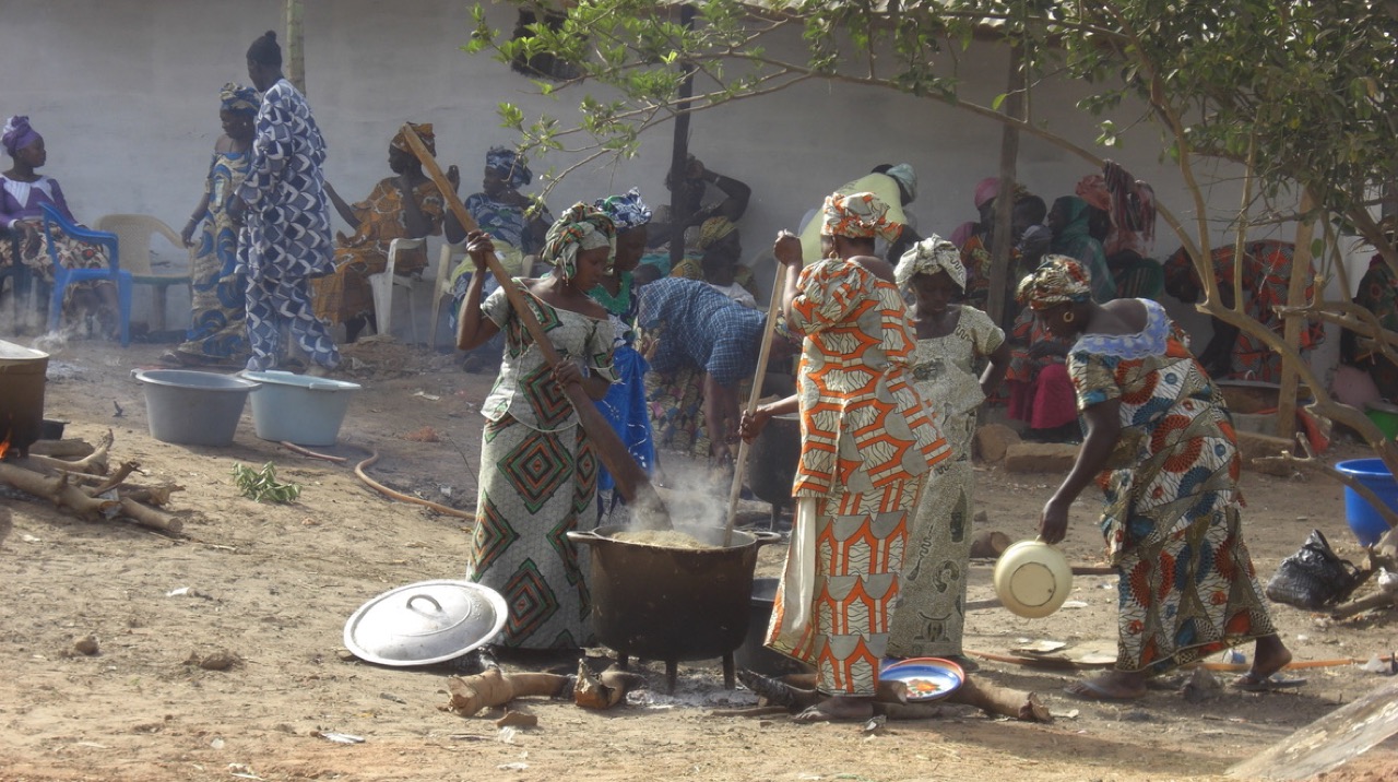 People preparing domoda stew, The Gambia