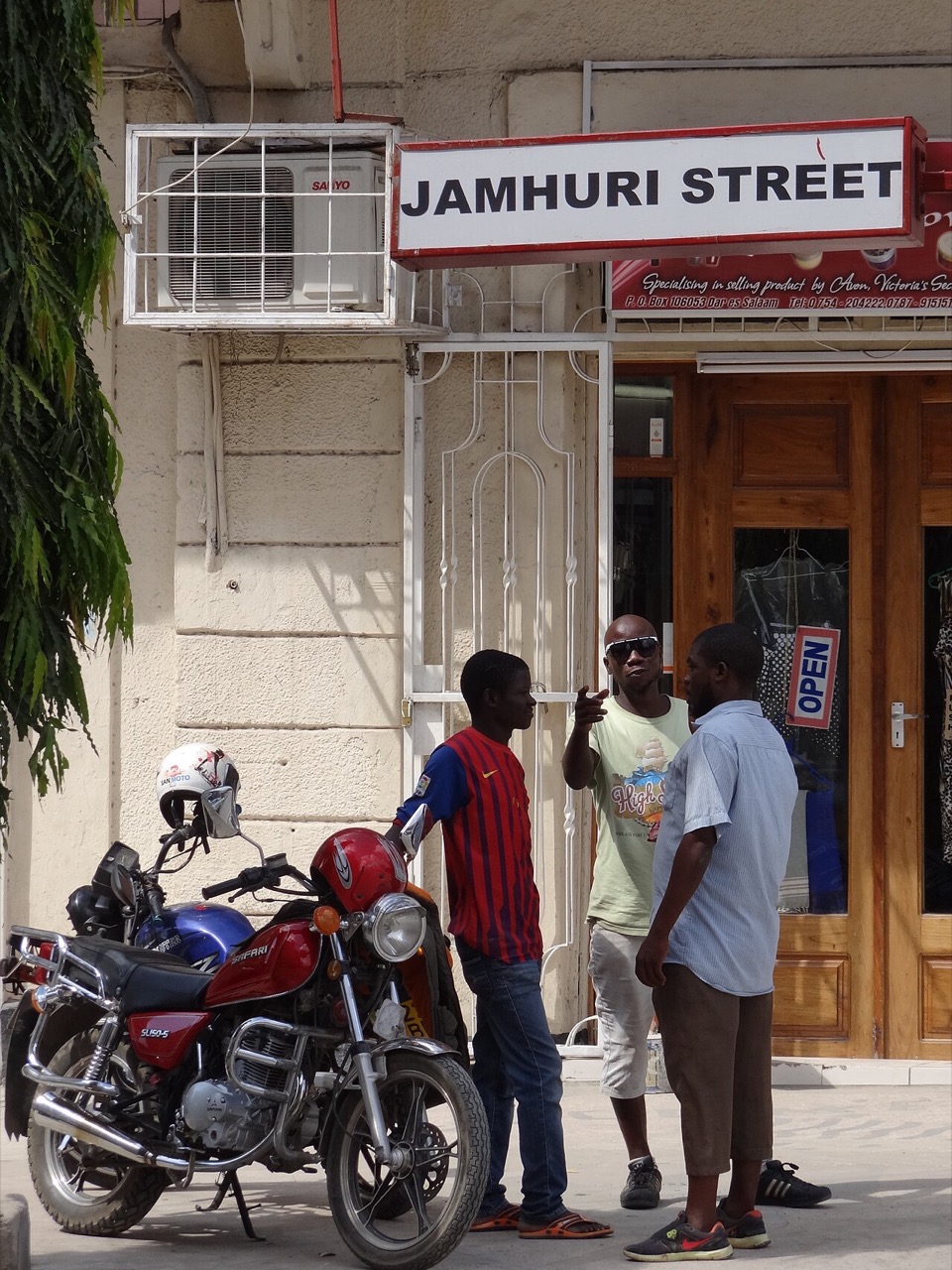 Young men on Jamhuri Street in Dar es Salaam, Tanzania