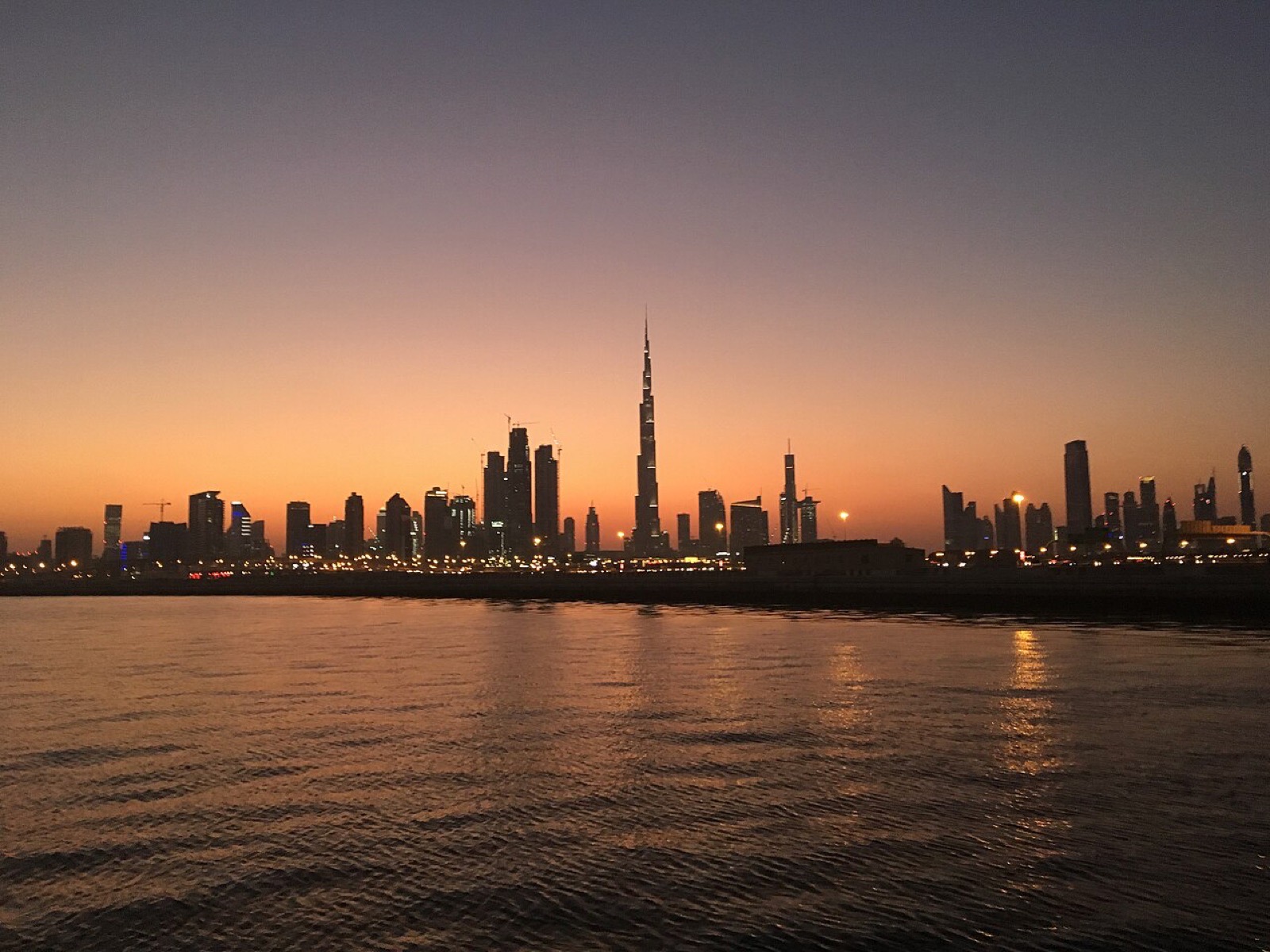 The Burj Khalifa and skyline at dusk in Dubai, United Arab Emirates
