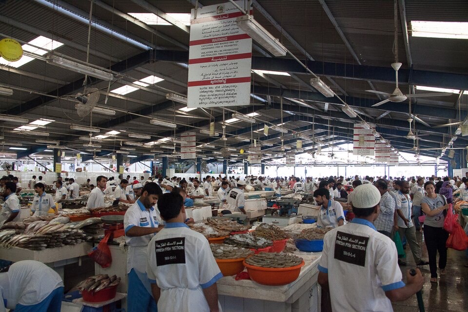 People at the fish market in Deira, Dubai, United Arab Emirates