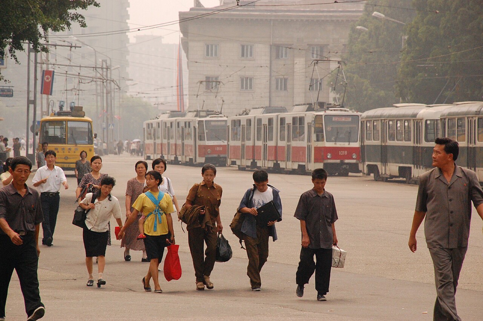 People walking along a street in central Pyongyang, North Korea