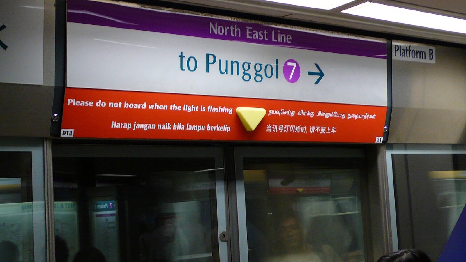 A Singapore metro sign in English, Chinese, Malay and Tamil