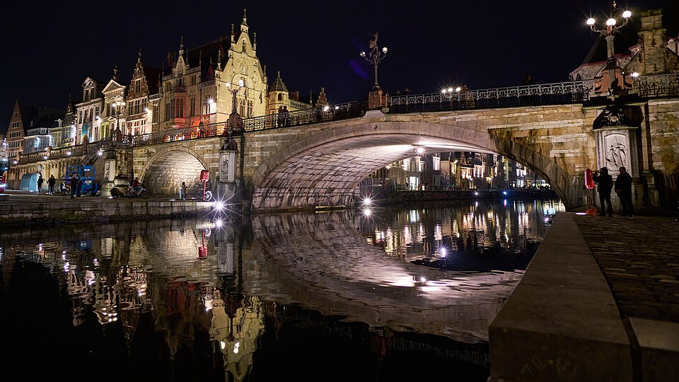 Saint Michaelโs Bridge illuminated at night in Ghent
