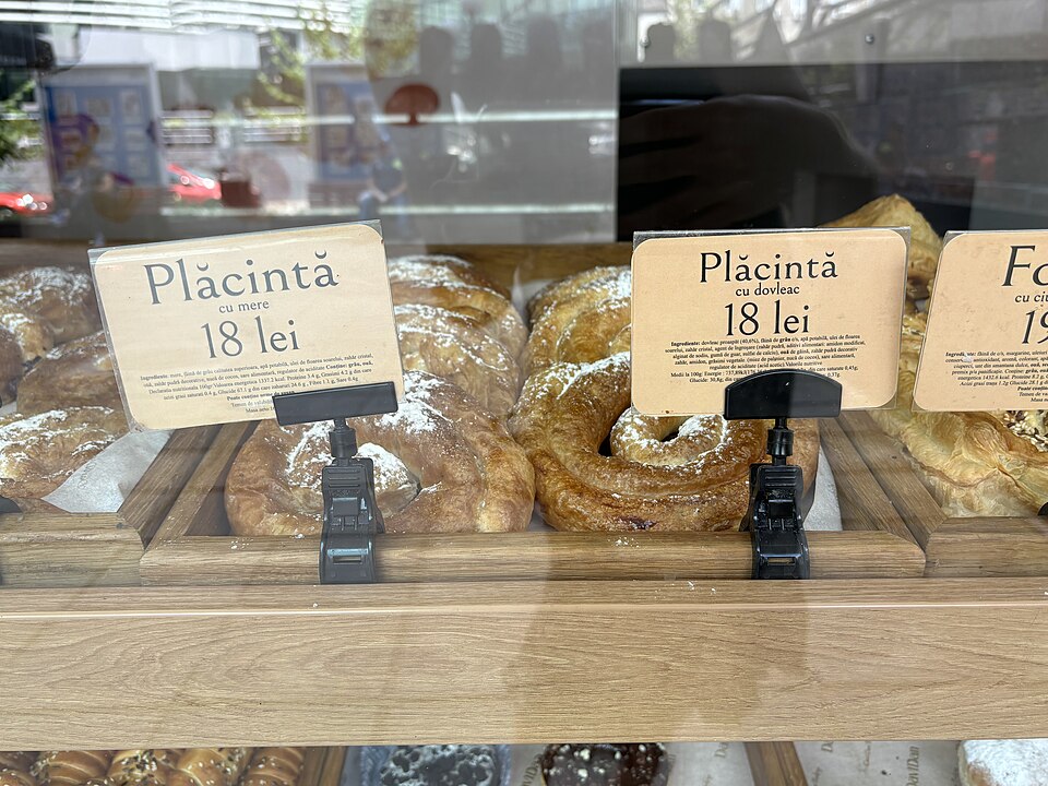 Apple and pumpkin plăcintă pastries displayed at a bakery in Chișinău