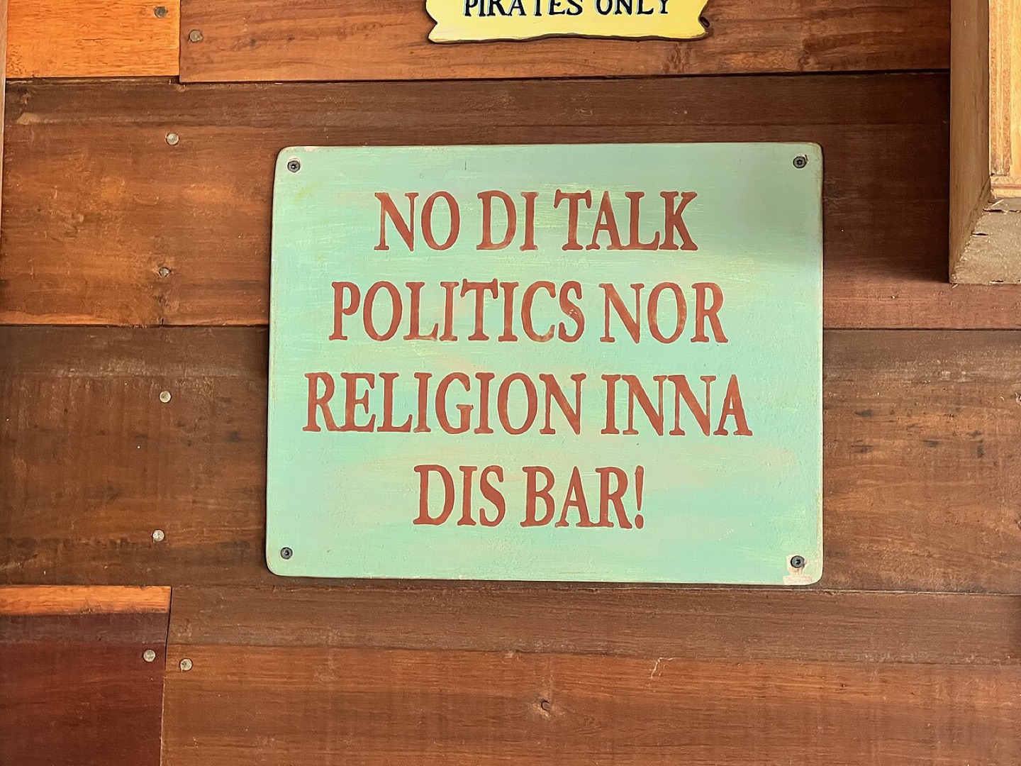 Belizean Creole lettering on a bar sign in Placencia, Belize