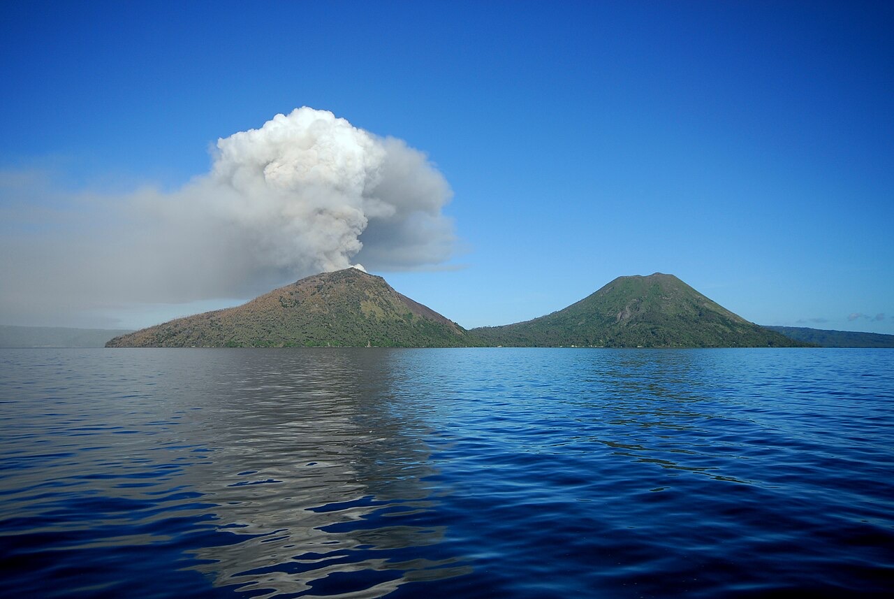 Volcanic cones and the Tavurvur plume near Rabaul, Papua New Guinea