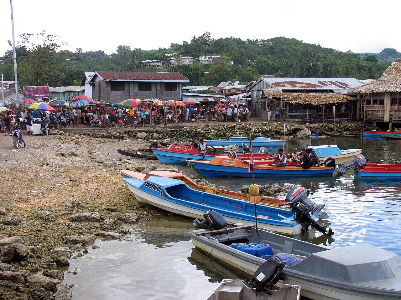 Goods arriving by boat at the market in Auki, Solomon Islands