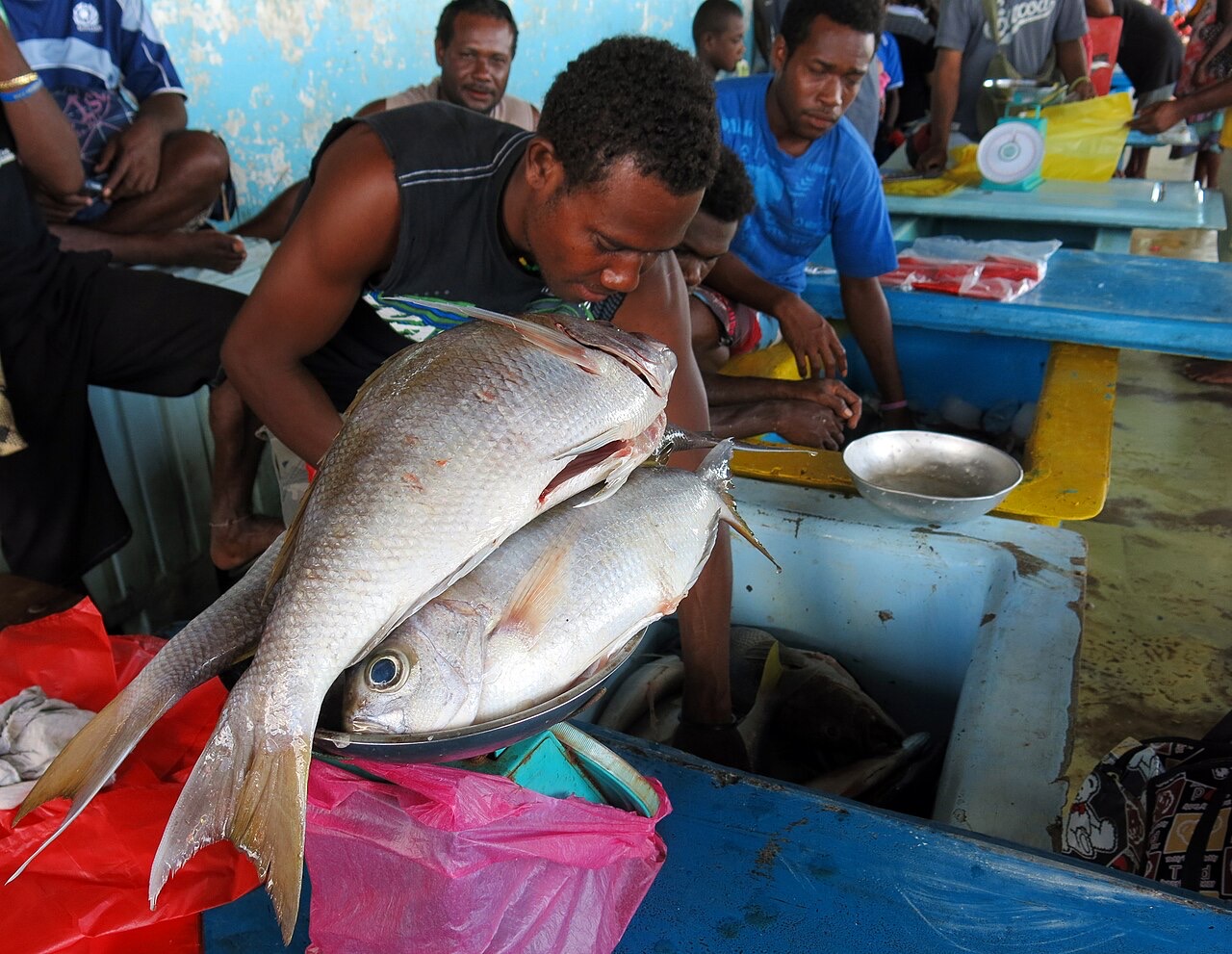 A fish seller at Honiara Central Market, Solomon Islands