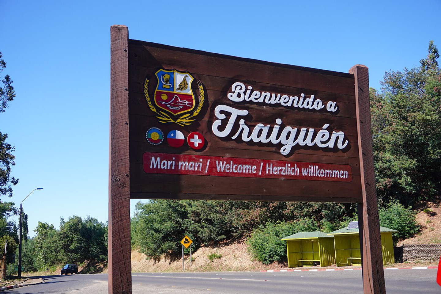A multilingual welcome sign in Traiguén, Chile