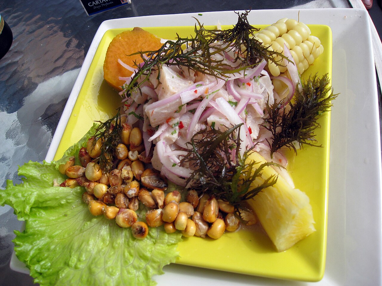 Fish ceviche with onion, chilli and sweet potato in La Punta, Callao