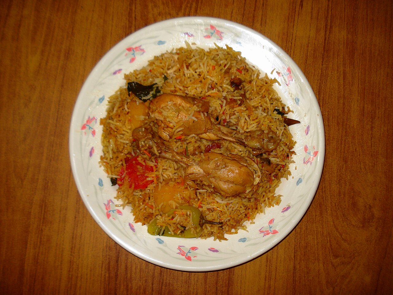 Punjabi chicken biryani with seasoned rice and pieces of chicken