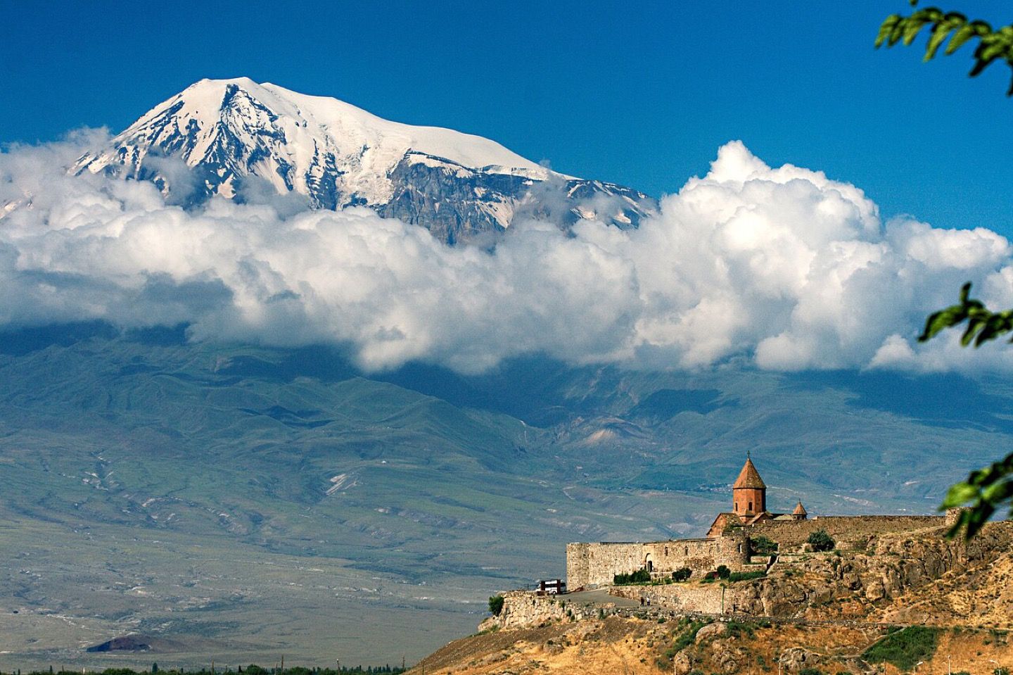 Khor Virap in Armenia with Mount Ararat, in Türkiye, beyond the plain