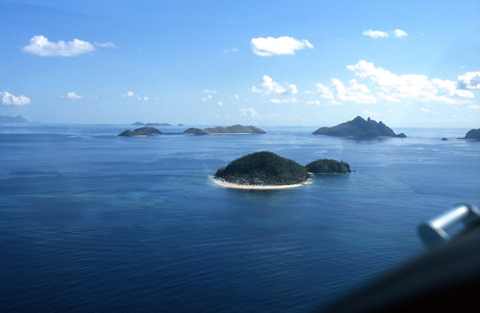 The Mamanuca Islands scattered across the blue sea in Fiji
