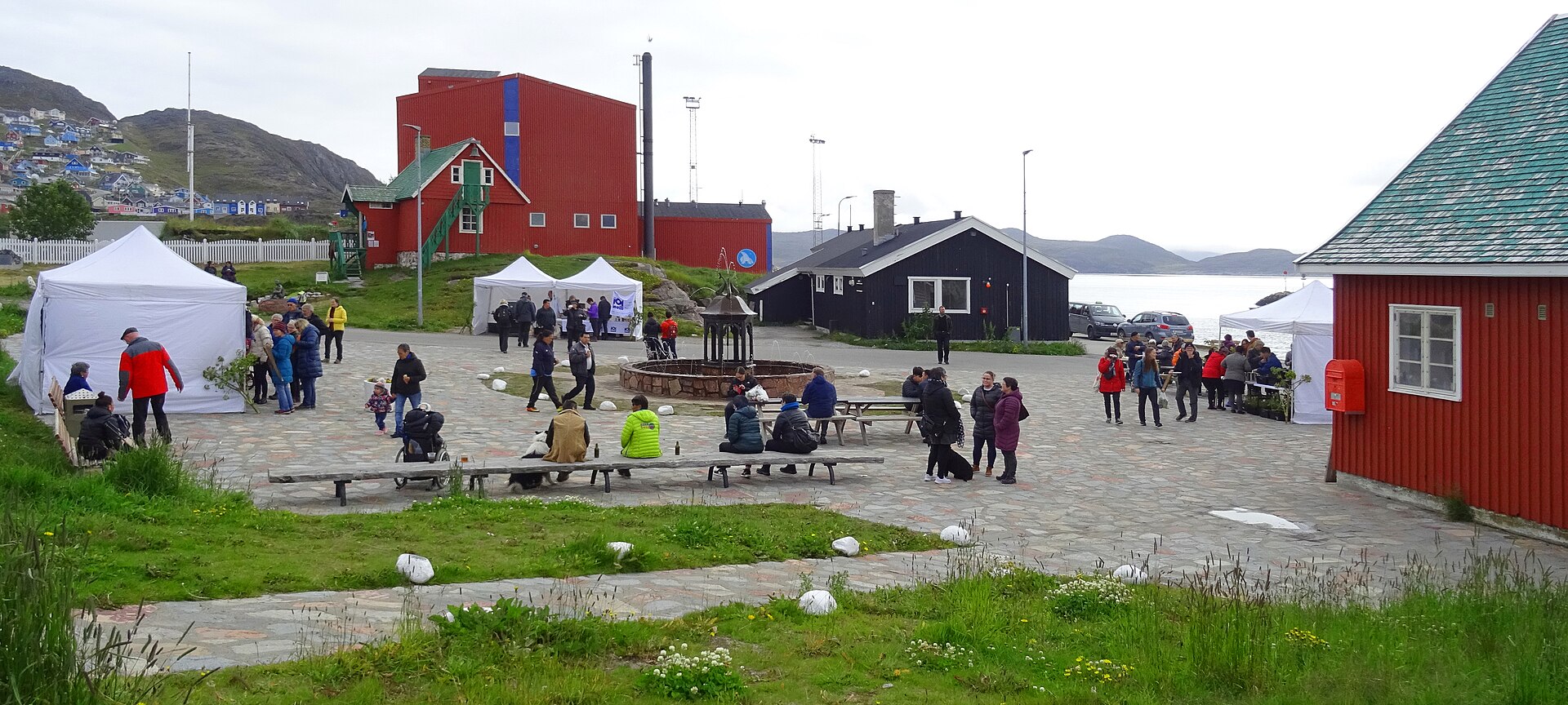 Qaqortoq market square and its fountain during a food festival in Greenland