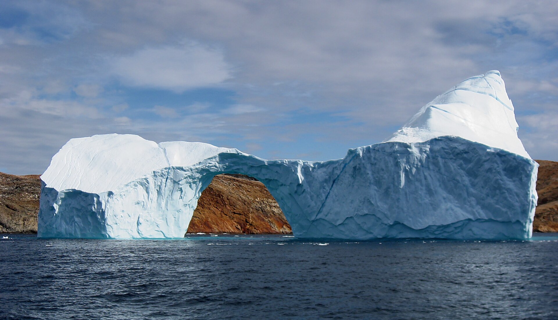 An iceberg with an opening near Sanderson Hope, Greenland