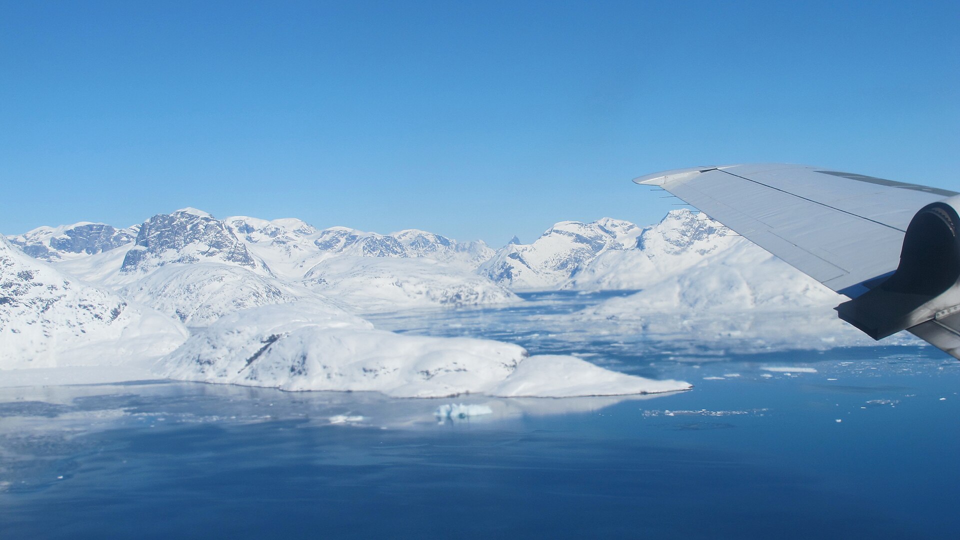 Mountains and a fjord in southeast Greenland seen from the air