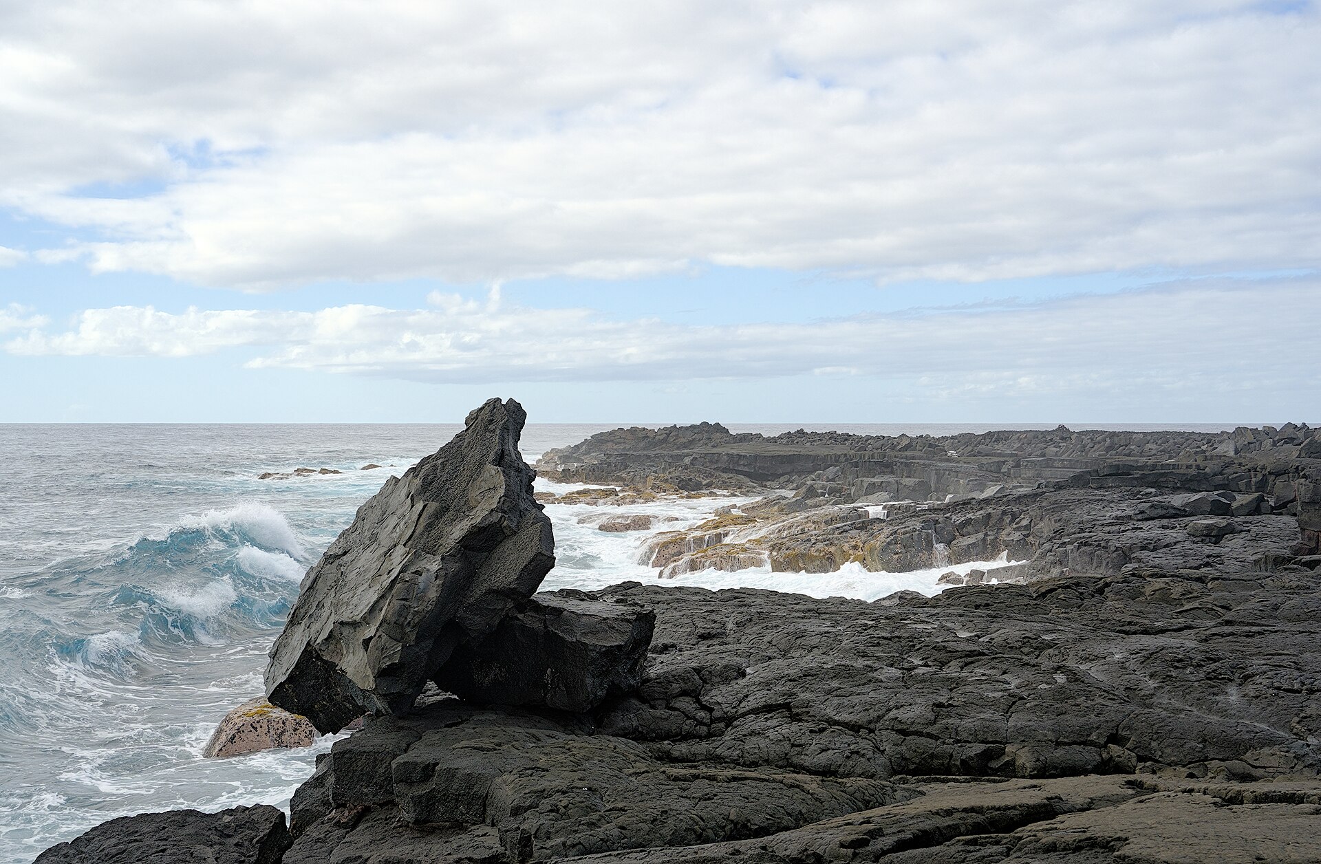 Pacific waves meeting the lava coastline of Hawaiʻi Volcanoes National Park
