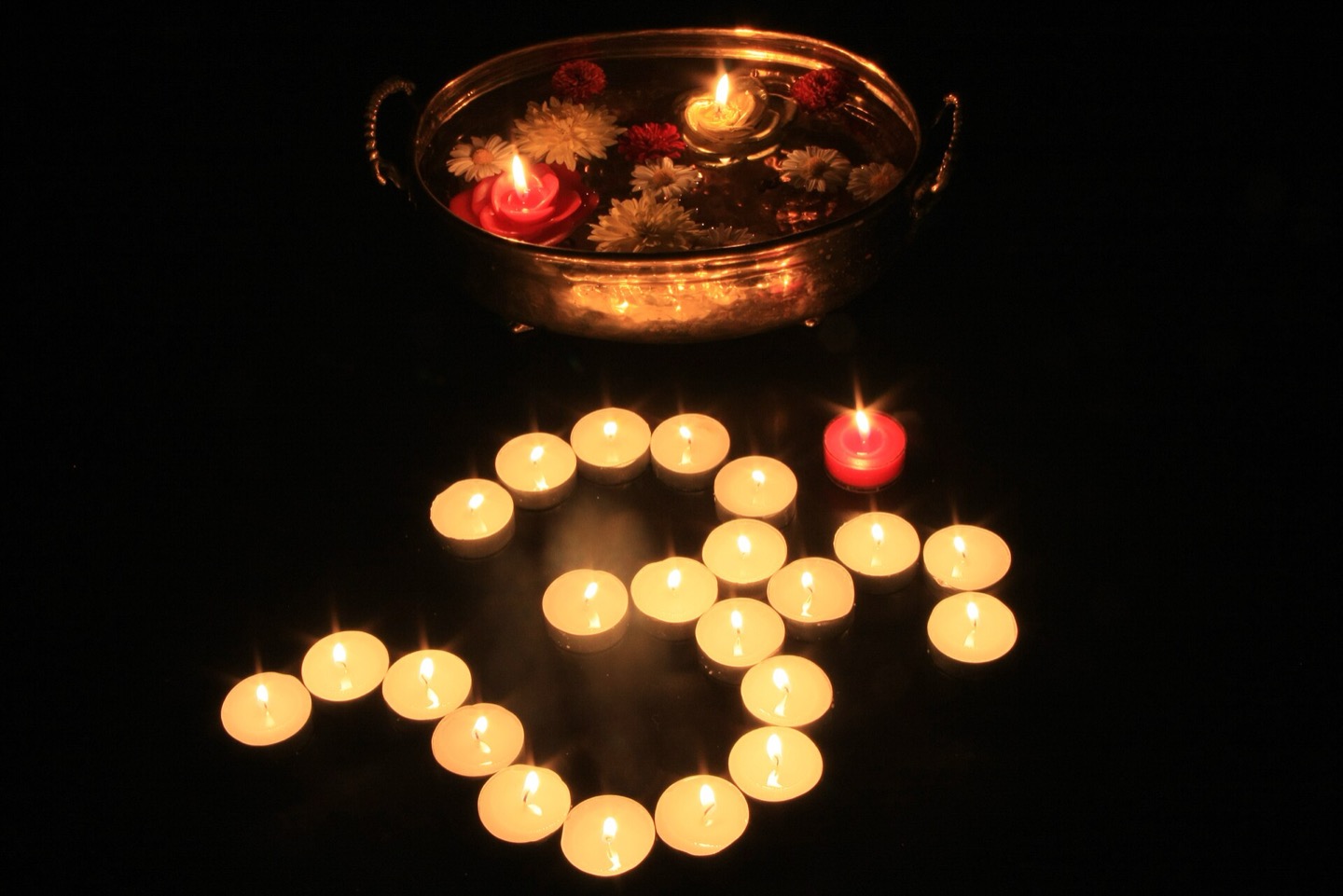Rows of lit diyas set out for Diwali