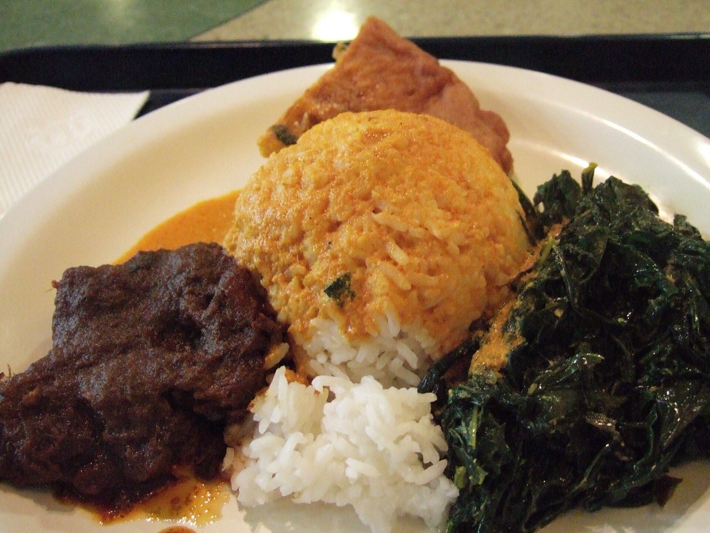 Indonesian rice served with beef rendang