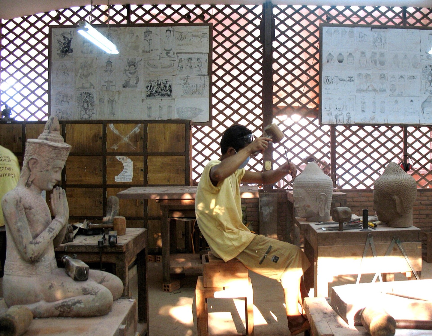 A craftsperson at work at Artisans Angkor in Siem Reap, Cambodia