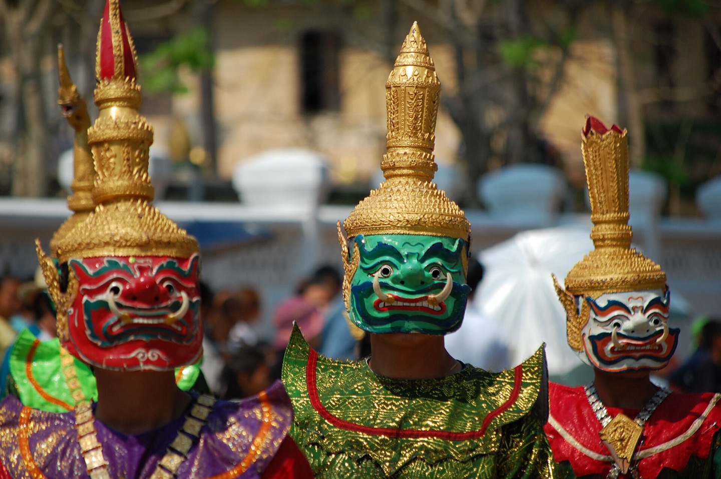 Traditional masks in a Lao New Year parade