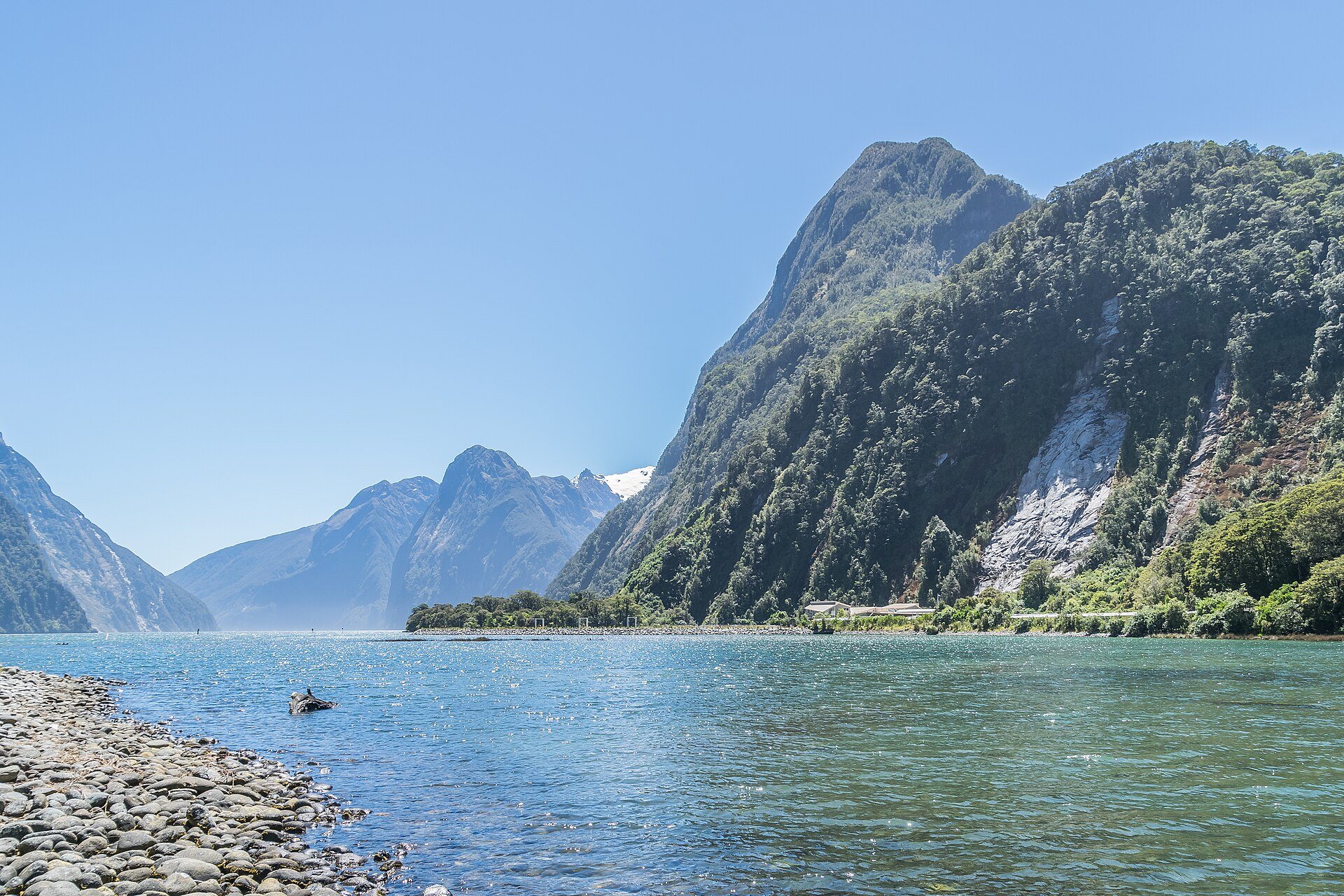 Milford Sound surrounded by steep mountains in Fiordland, New Zealand