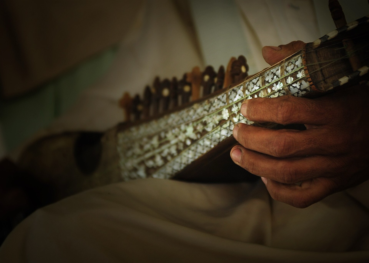 A musician playing the Afghan rubab in Farah, Afghanistan